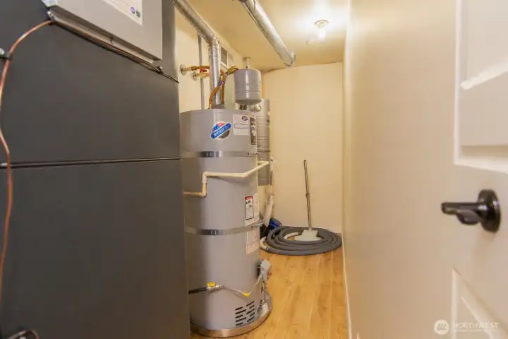 Utility room with built-in central vacuum system for convenient whole-home cleaning.
