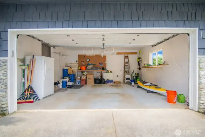 Generous two-car garage with additional storage for tools and outdoor gear.