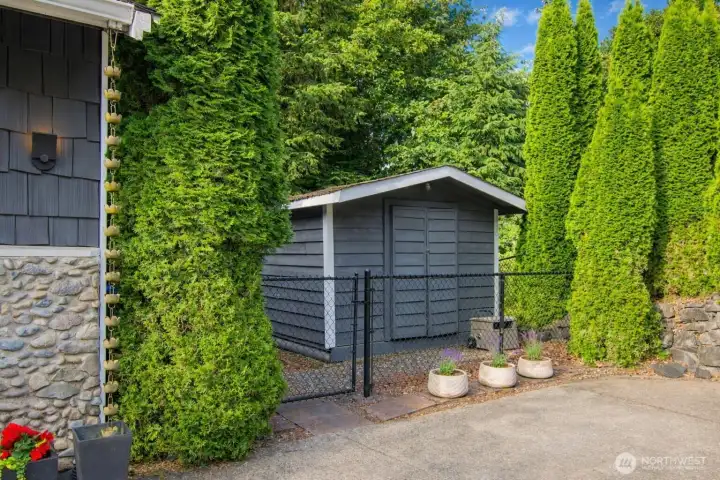 A well-kept outdoor shed providing extra space for equipment and organization.