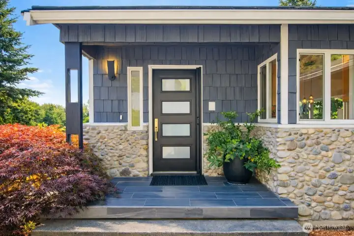 The home’s front door creates a bright and inviting entrance.