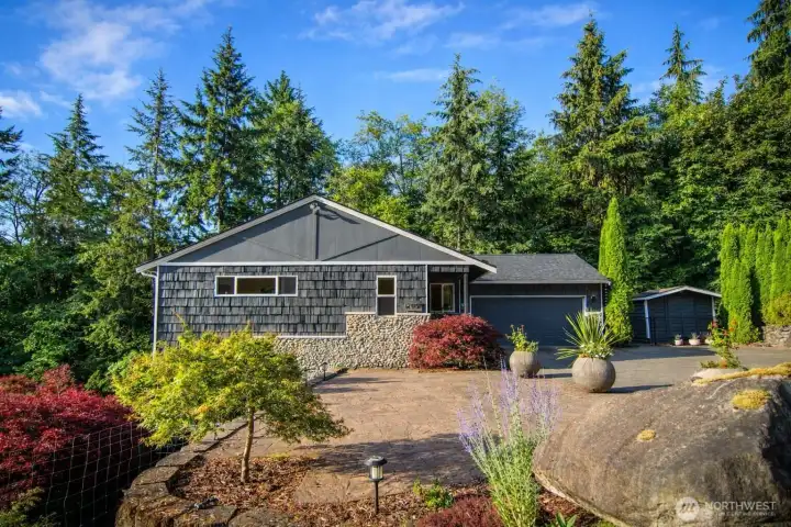 A view along the side of the home, highlighting its structure and landscaping.