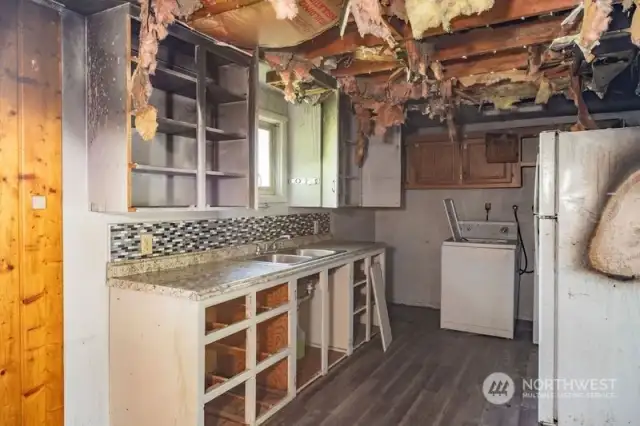 kitchen on second level with fire damage.