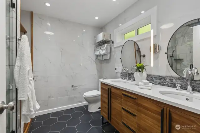 This stunningly remodeled primary bathroom will make every day feel like a day at the spa!