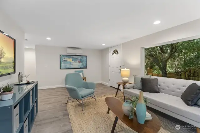 This large, flexible family room takes in views of the backyard and has its own separate entrance - AirBNB potential abounds!