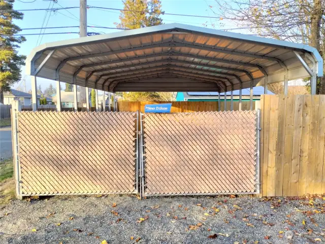 Big carport in fully fenced area.