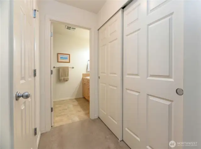 Primary Closets And Entrance To Primary Bathroom