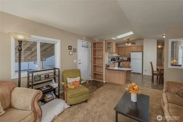 Entrance, living room and kitchen with eating area