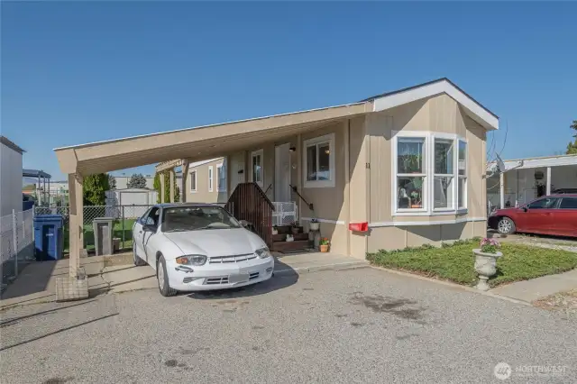 Home and carport with additional parking