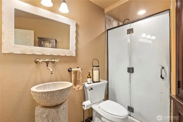 Main floor 3/4 bath is located between the garage and utility room. Someone comes in dirty, this can be their first stop!