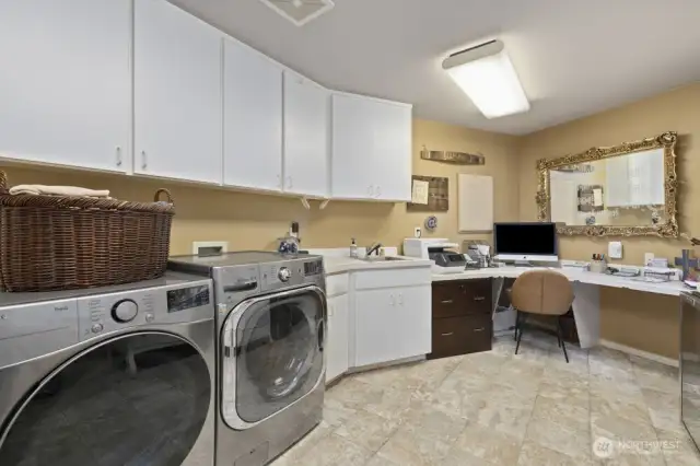 Behind the main floor ¾ bath, you’ll find a versatile utility room that doubles perfectly as a home office or hobby space.