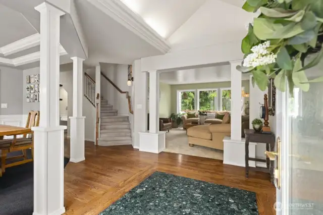 Original oak hardwoods lead you through the home.