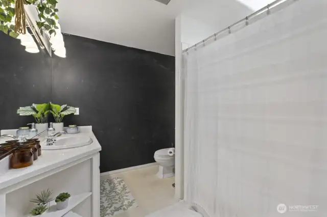 Upstairs full bath has a ton of natural light.