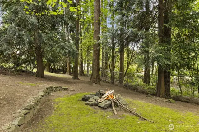 Tucked among the trees, a hidden firepit invites cozy nights under the stars.