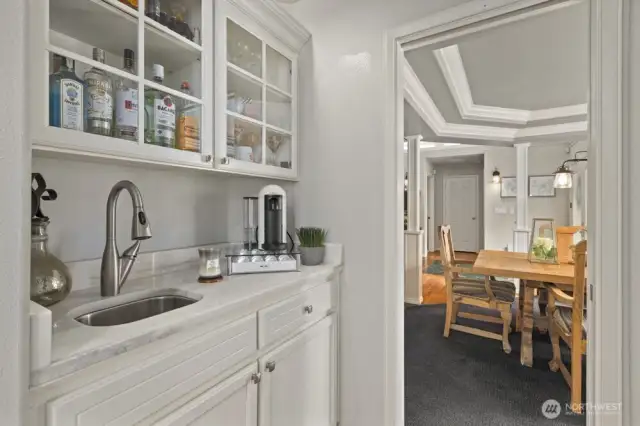 Butlers pantry is conveniently located between kitchen and dining room.
