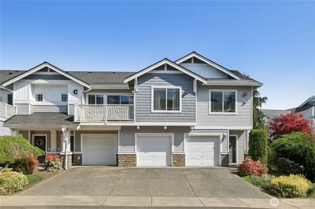 Unit above garages; entry door to left; garage to right of entry