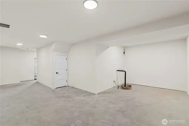 HUGE downstairs basement! Construction is still being finished up yet this picture captures the size of the room.  What a great bonus area gaming room this would make!