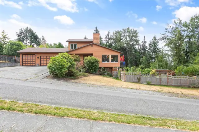Situated on a quiet corner lot on a dead-end street, just off the interurban trail system.