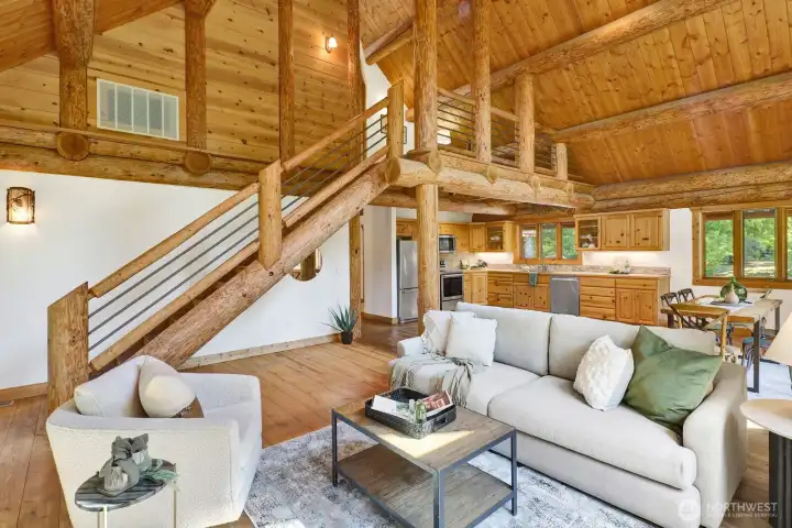 Note the upper loft area which features a sitting area and a huge primary suite