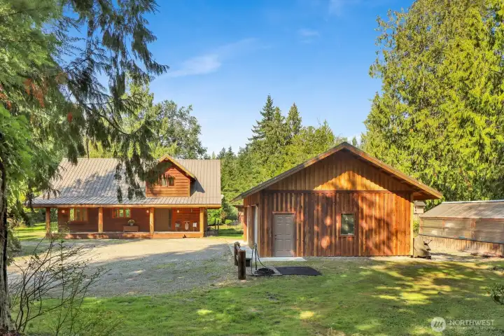 Another view of the home, shop, and circular drive