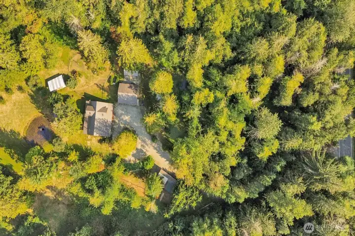 A view of the home, shop, and out-buildings from above
