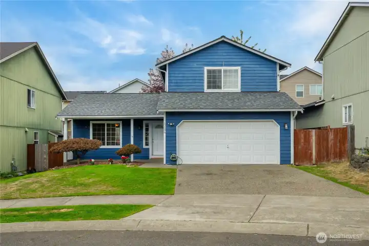 This angle emphasizes the home’s attractive color contrast and updated roofline, giving it a crisp and modern appearance.