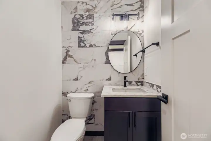 Main-floor guest powder room with modern finishes