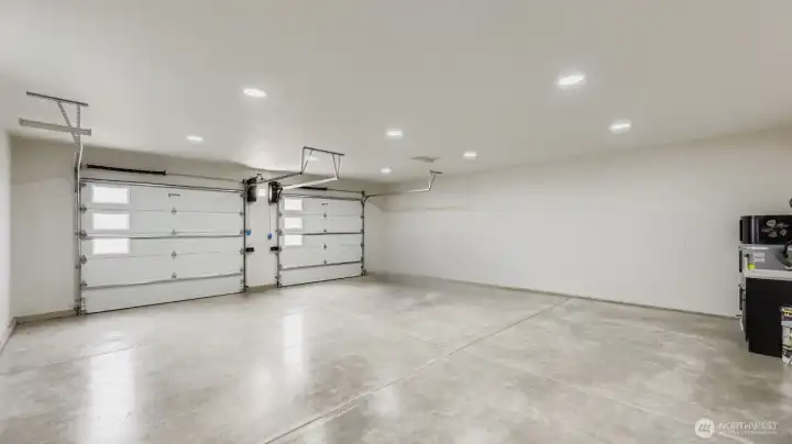 Generously sized insulated garage with painted finish