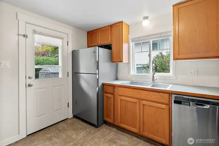 Kitchen opens to back yard and patio
