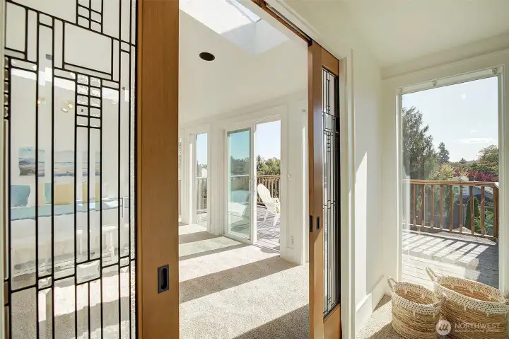 Enter Upper level Primary bedroom through gorgeous pocket doors