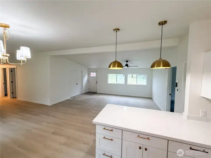 Kitchen with view of office and primary