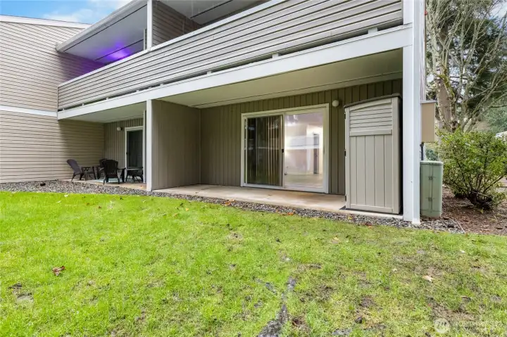 Spacious private end-unit covered patio perfect for morning coffee, relaxing outdoors, & additional storage