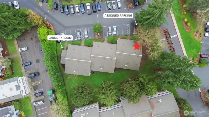 Assigned unit parking spot steps from the front door, community EV charging, and guest parking lot conveniently located directly across from the condo