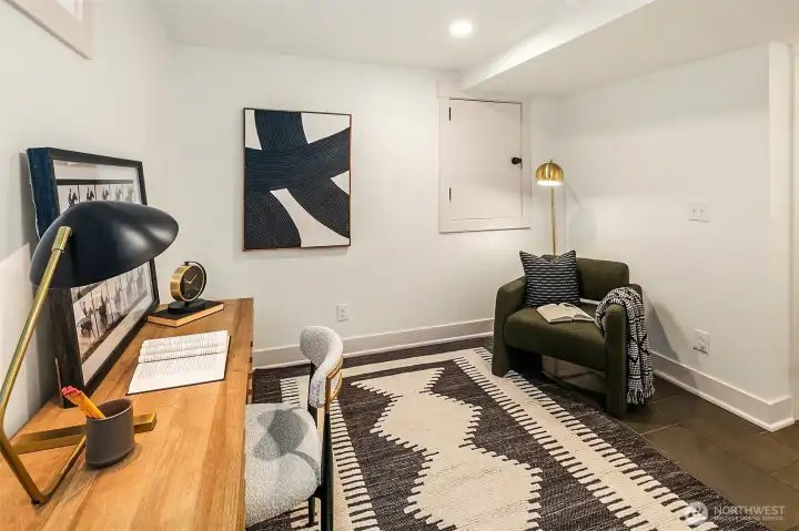 Downstairs bonus room. Has been used for movie watching and storage.