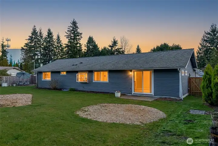 Imagine summer evenings out here with so much backyard space to enjoy.