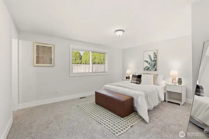 The primary bedroom offers a peaceful place to recharge at the end of the day.