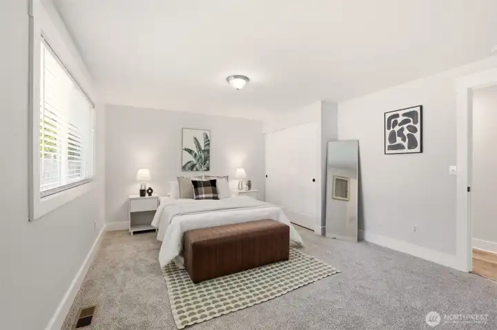 Another bright bedroom that feels calm and welcoming.