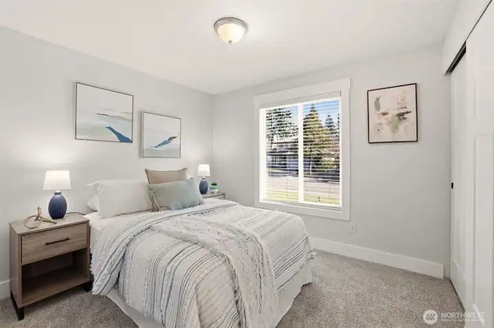 A cozy bedroom with natural light and plenty of possibilities.