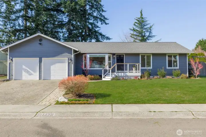 A welcoming front yard that adds to the home’s curb appeal.