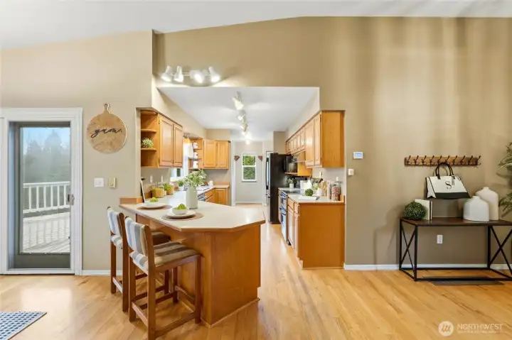 The kitchen is thoughtfully positioned at the center of the home, offering easy flow to both the dining and living areas.