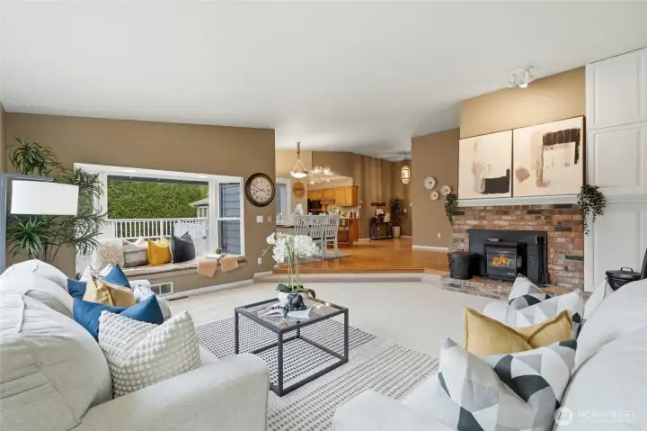 A charming window seat offers the perfect spot to curl up with a book while enjoying views of the surrounding greenery.