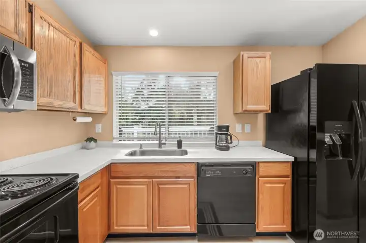 Kitchen has quartz countertops and all the conveniences