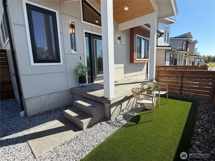 Perched above the street with a lovelty covered entry.