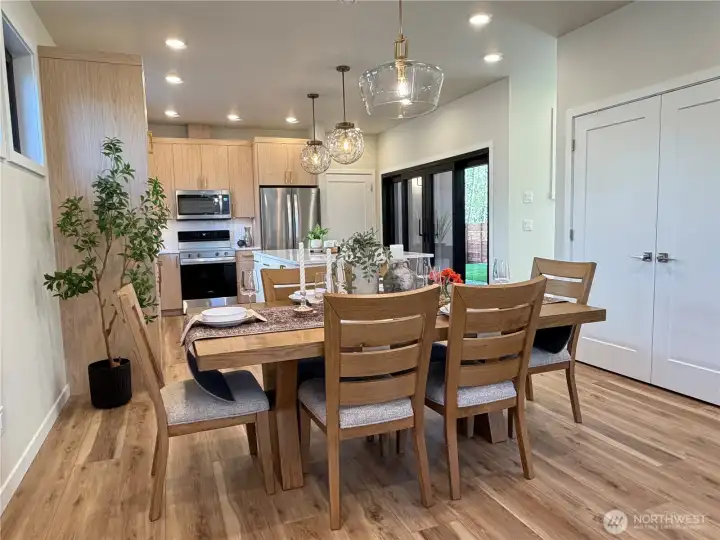 Spacious dining area with beautiful lighting.
