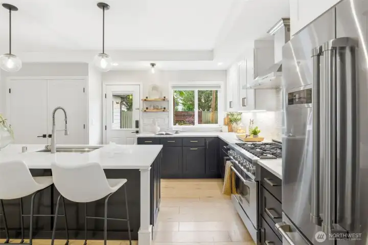 Kitchen with an island with counter space.
