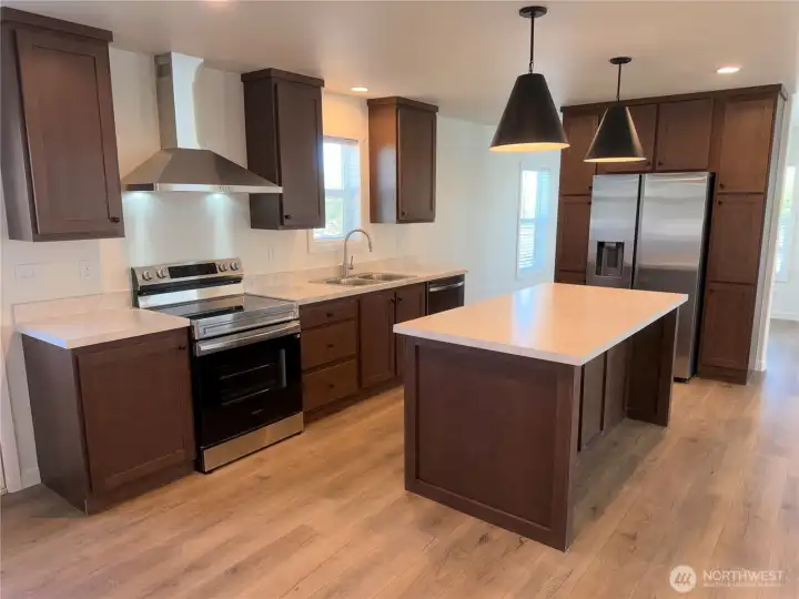 Kitchen w/SS appliances and pantry.
