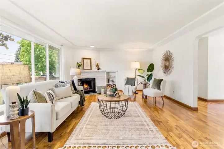 Designed for both comfort and connection, the living room serves as the heart of the home.