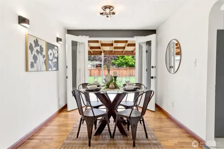 Host memorable dinners in this bright dining space, where elegant French doors open to a covered patio and private backyard retreat.
