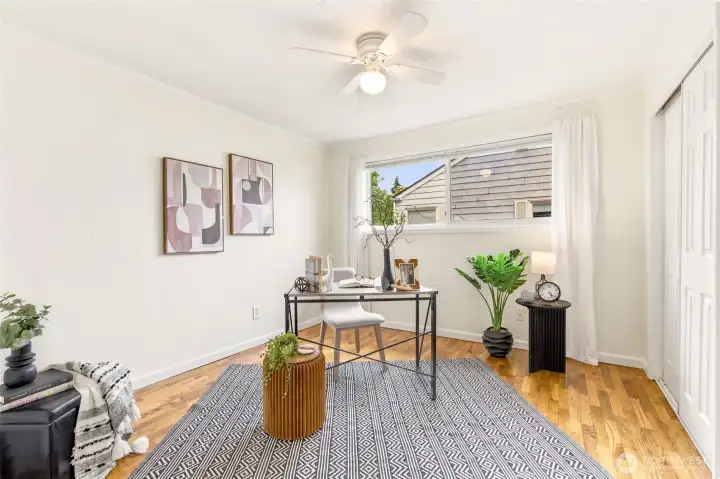A flexible secondary bedroom provides the perfect space for guests, remote work, or hobbies.