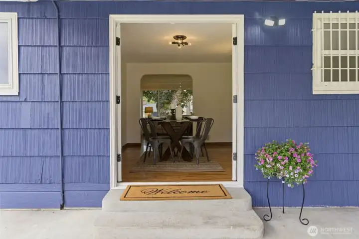 French doors create a seamless transition between indoor and outdoor living, extending the home's living space into a private backyard retreat.
