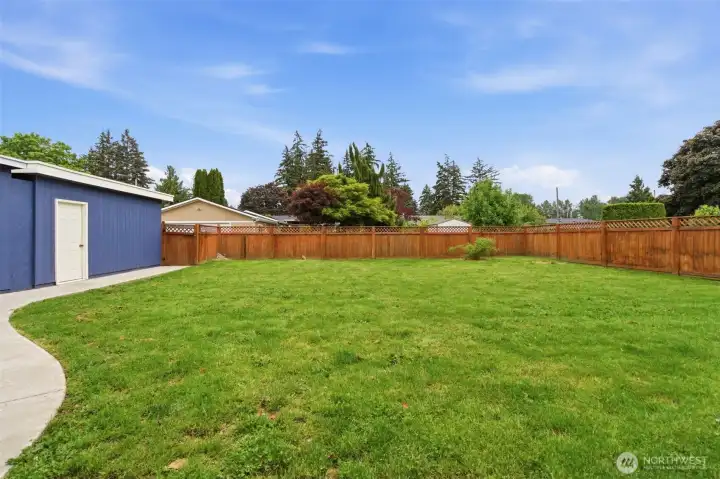 Alley access at the rear of the property enhances convenience while maintaining the privacy and usability of this generously sized backyard.